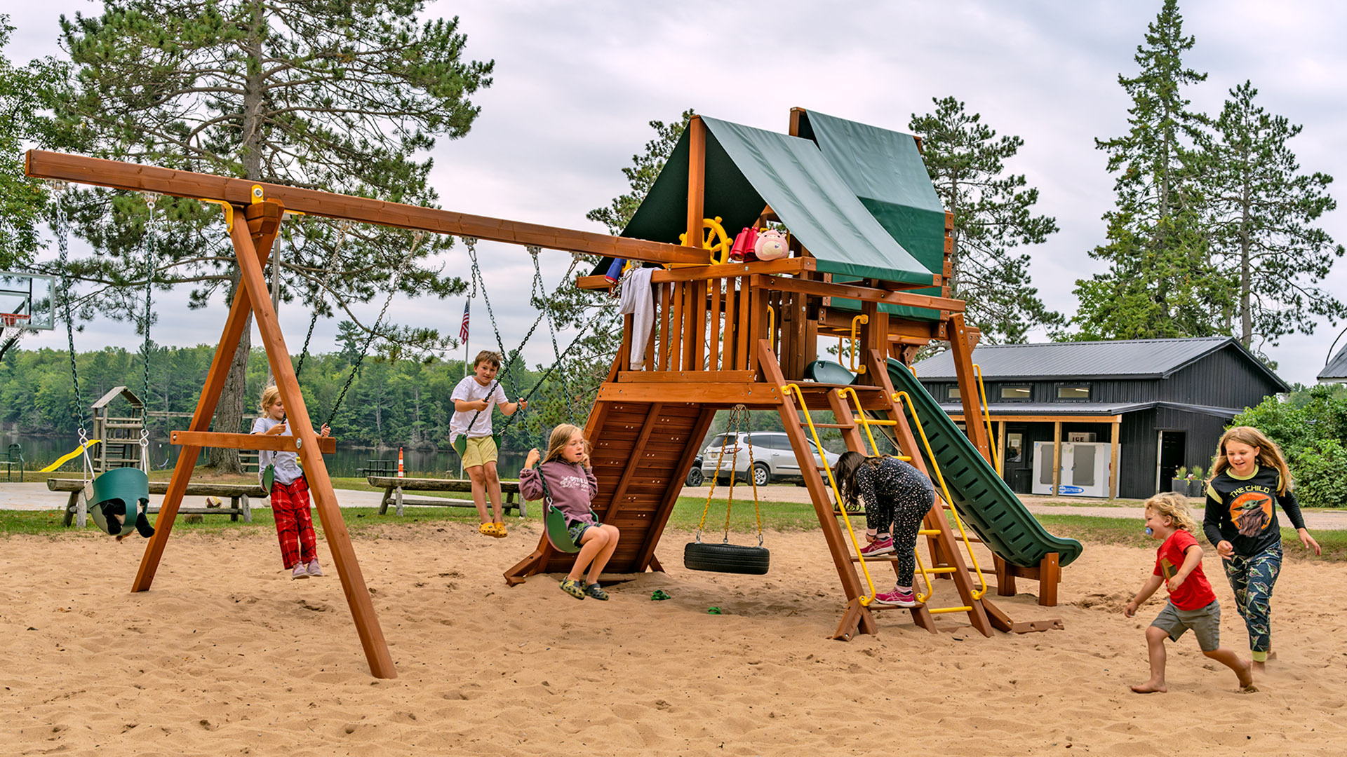 Children using playground at Otter Lake